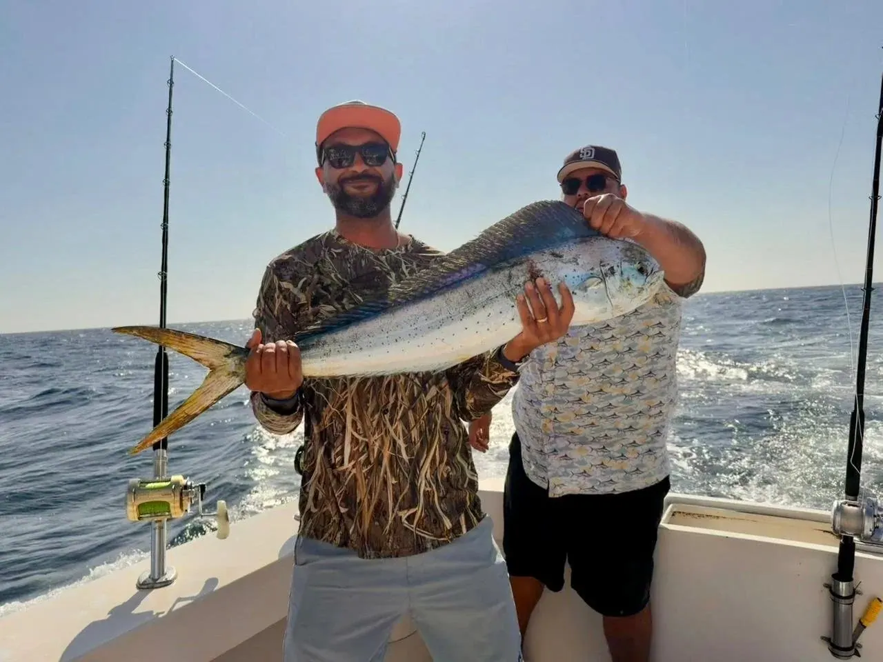 Two anglers with a yellowfin tuna, late March 2026