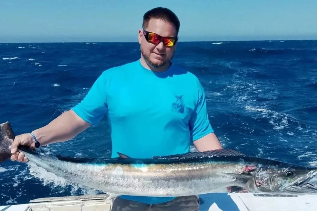 Angler with a wahoo, early March 2026