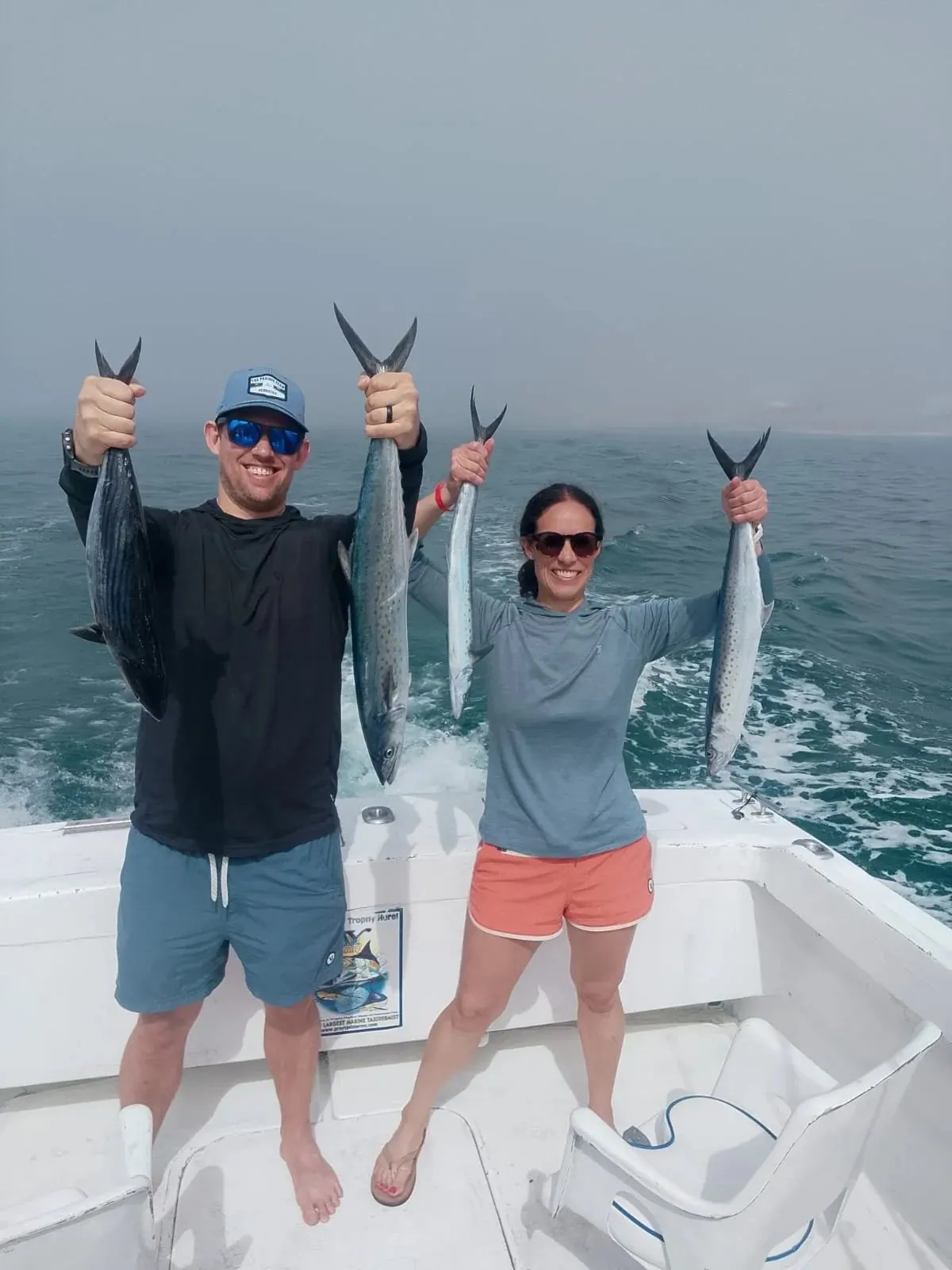 Two anglers with a pair of fish each, early March 2026