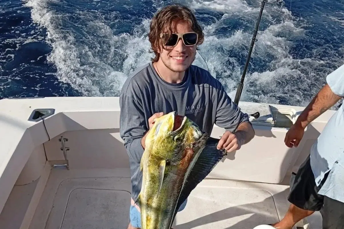 Young angler with a dorado, late March 2026