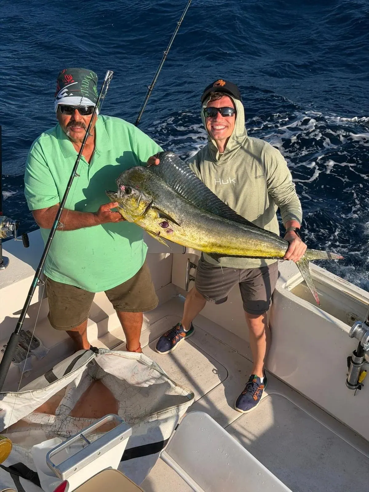 Two anglers with a dorado, early March 2026