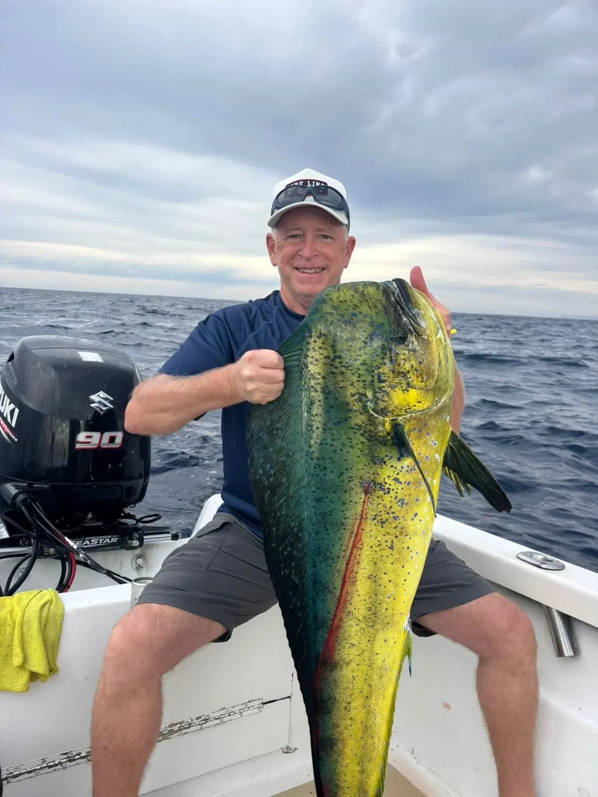 Angler with a bull dorado, February 2026