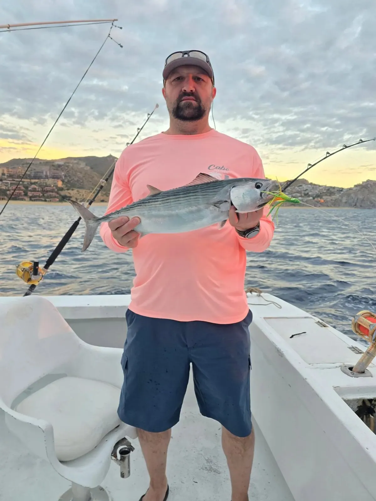 Angler with a fish caught at sunrise, January 2026