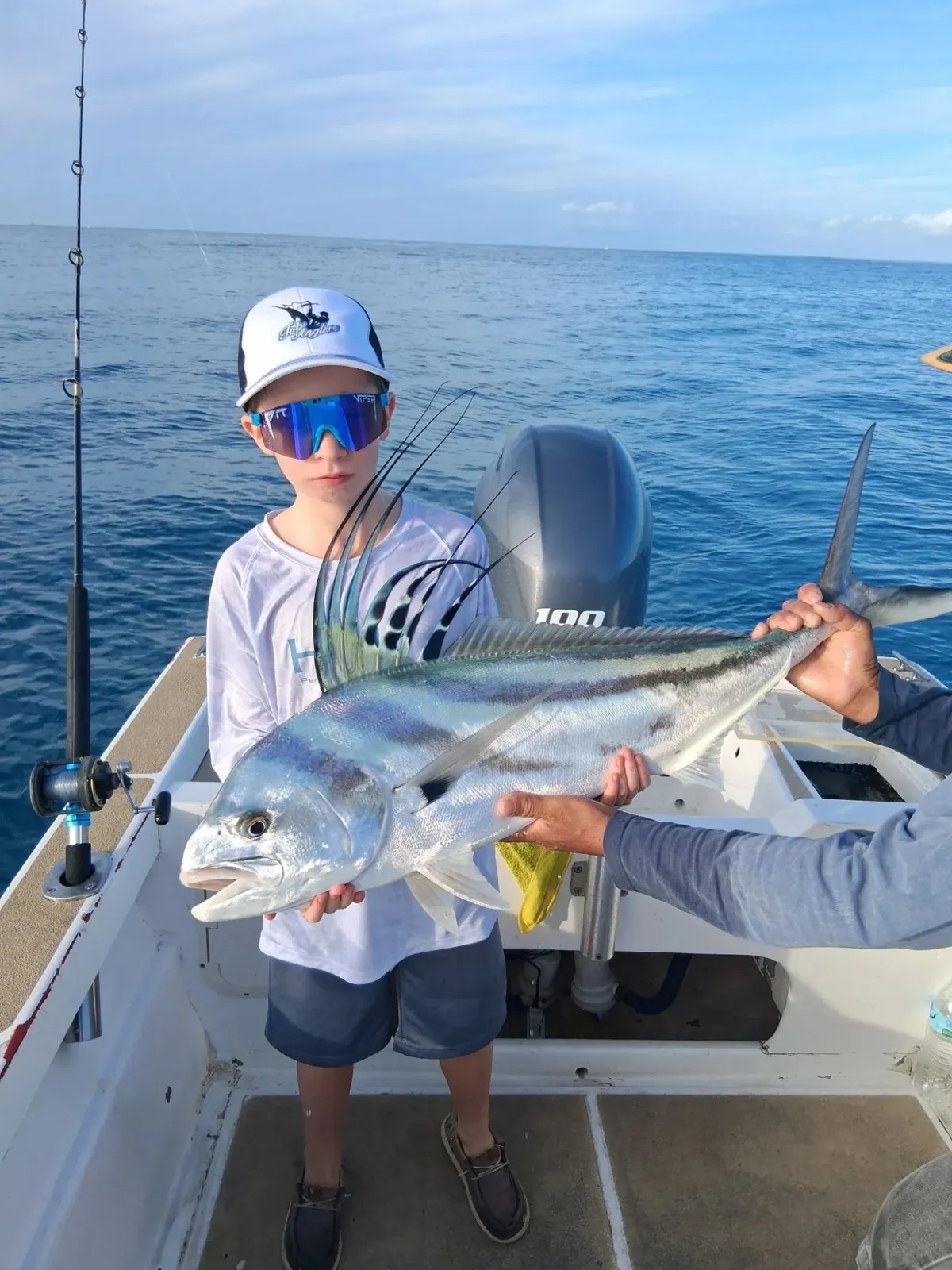Young angler with a roosterfish, January 2026
