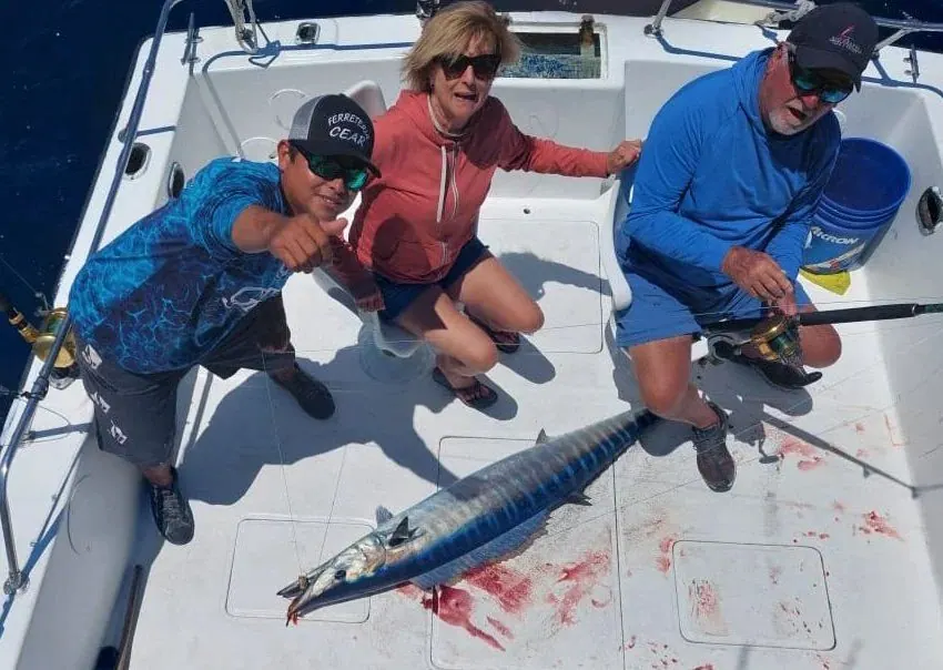 Group with a wahoo on the deck, May 2025