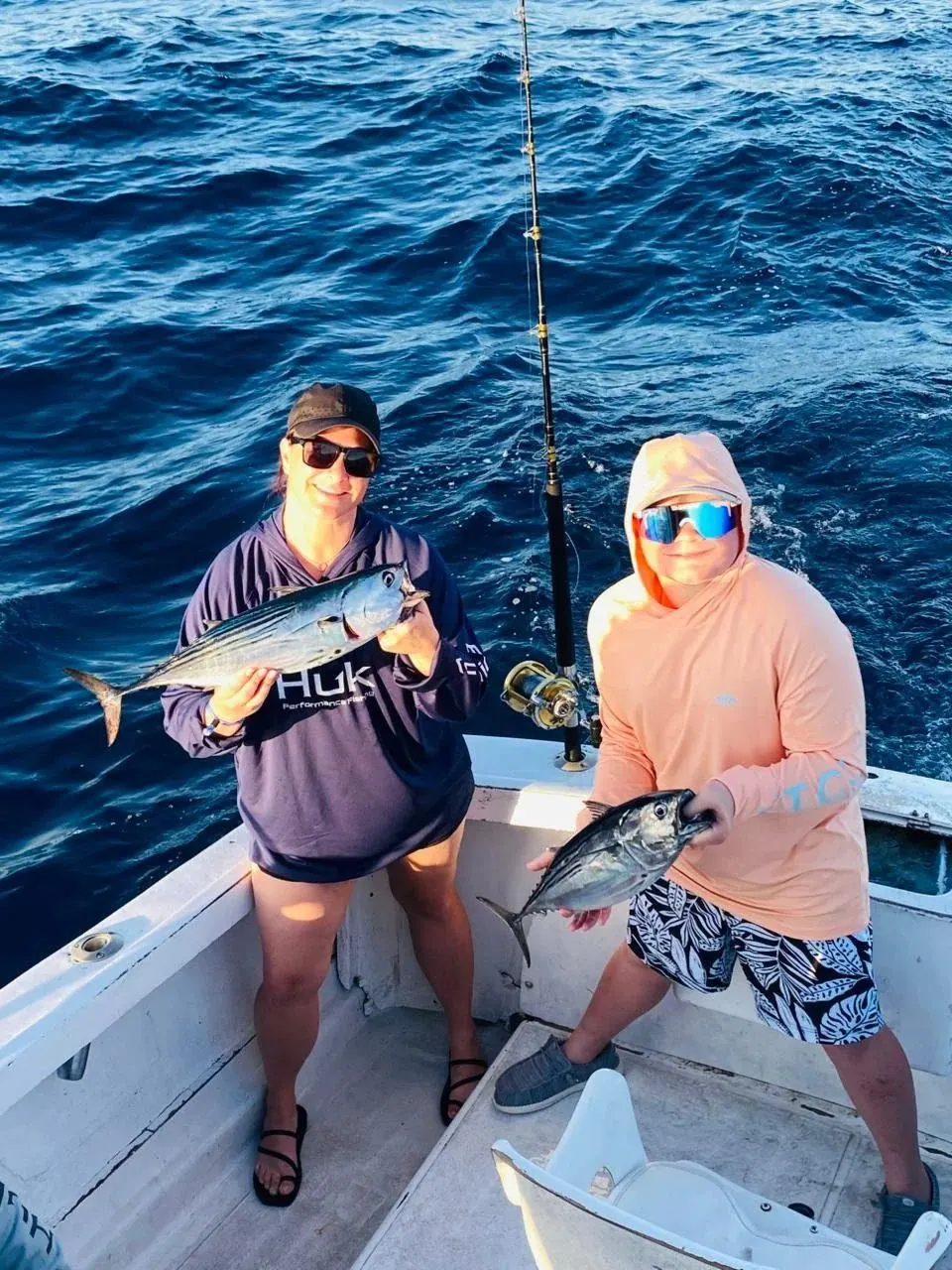 Two anglers with yellowfin tuna, late March 2026