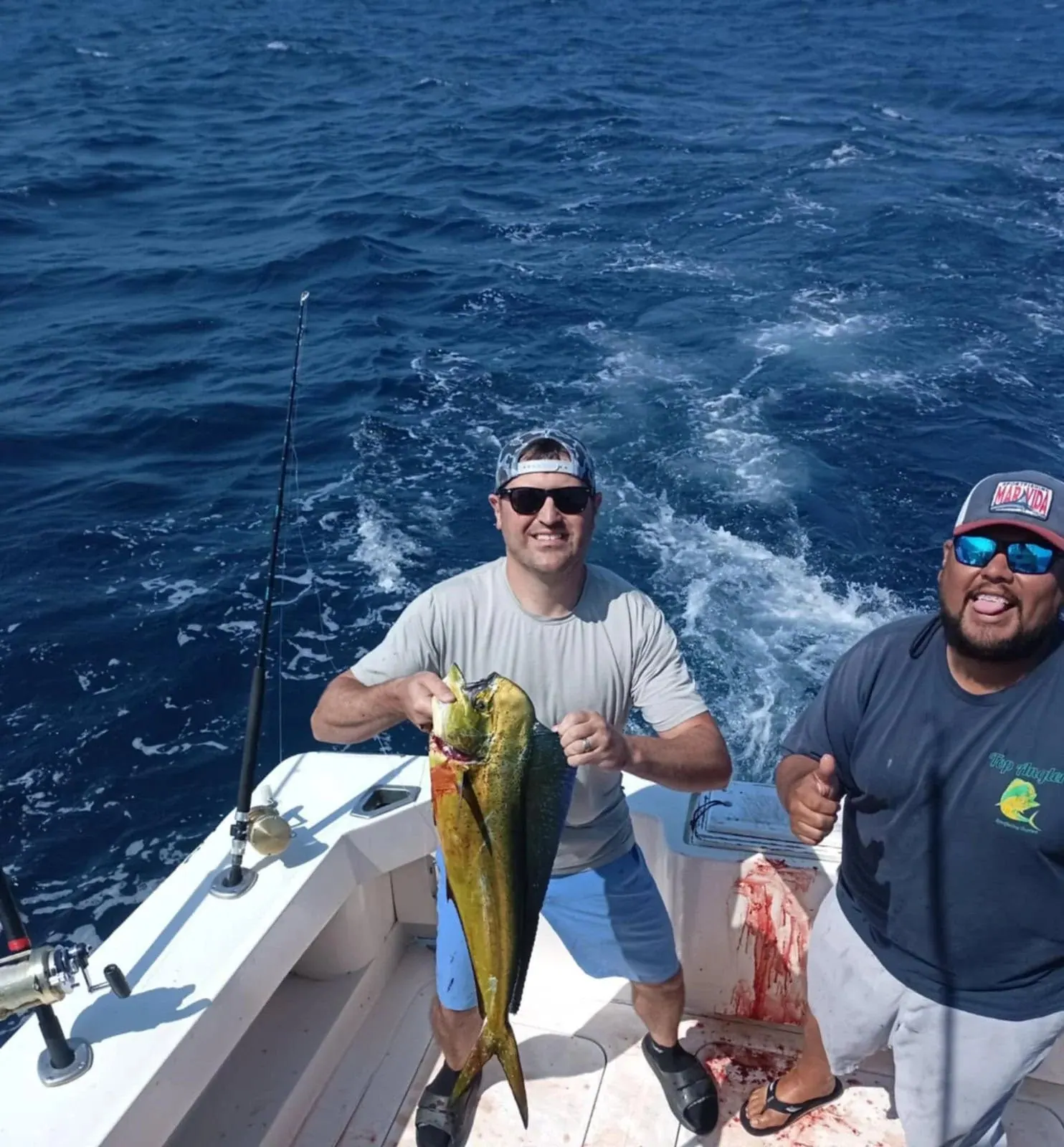 Two anglers with a dorado, late May 2025