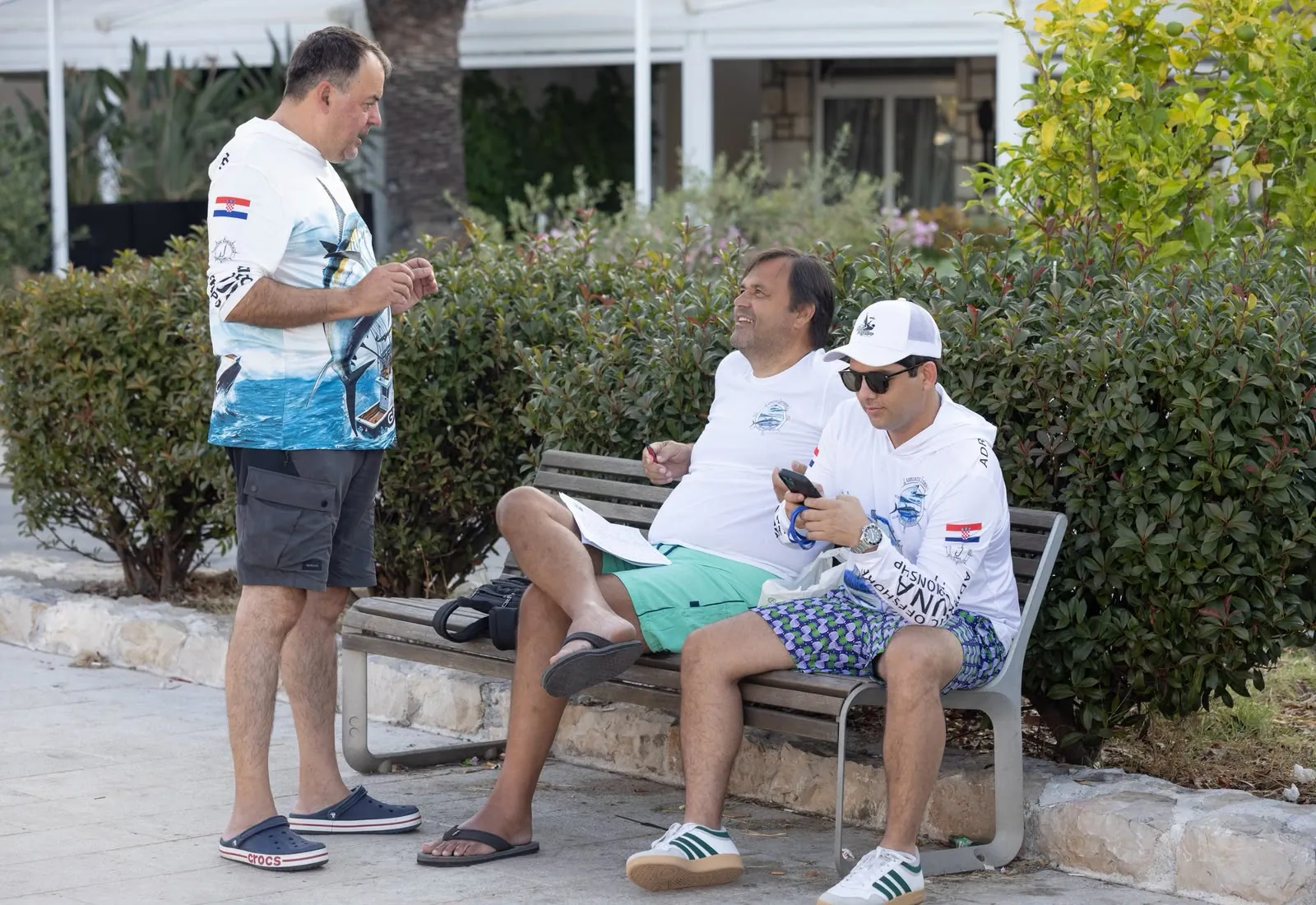 Max Vargas with tournament officials between fishing days in Rogoznica