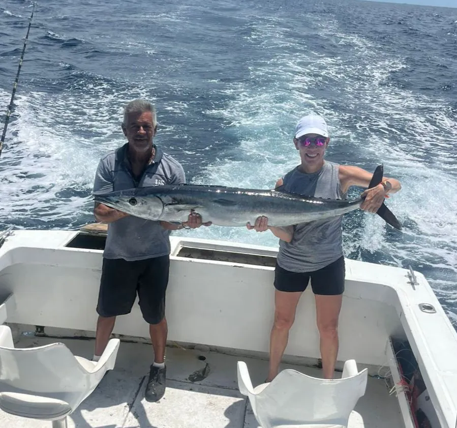 Couple with a wahoo, late August 2026