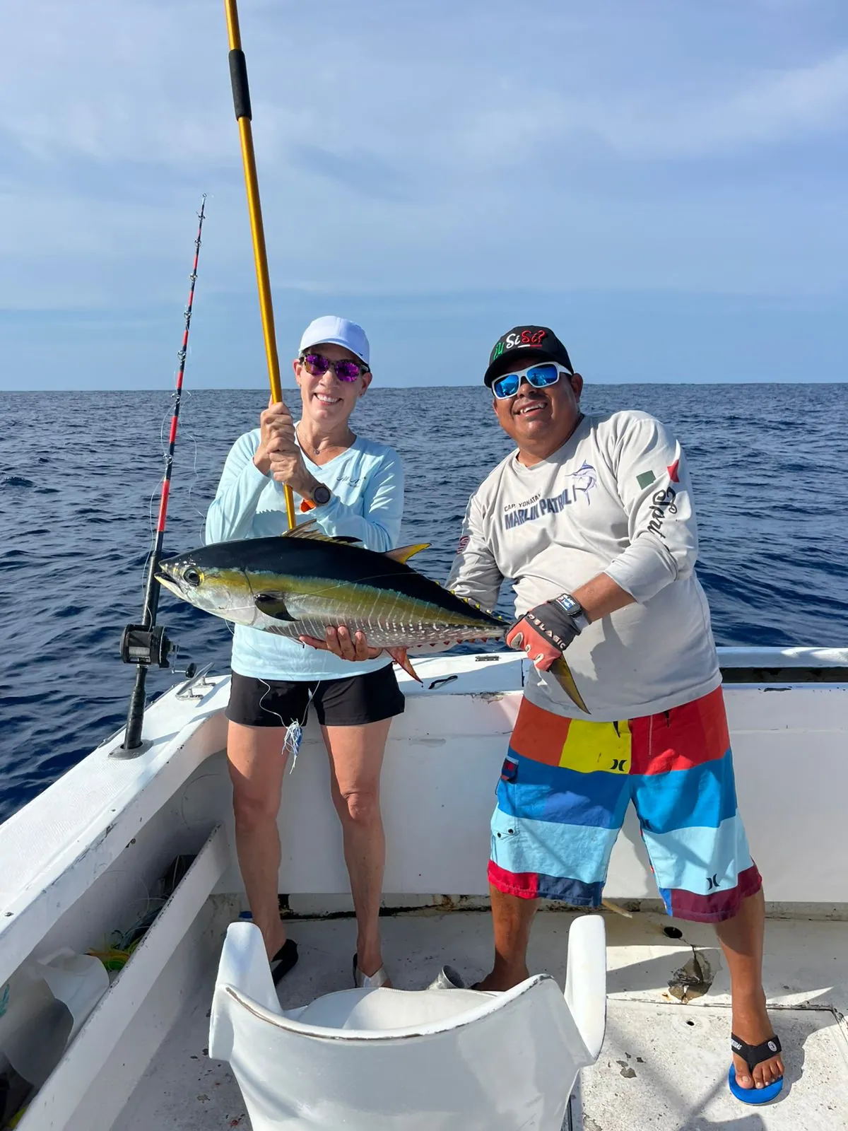 Angler and crew with a yellowfin tuna, August 2026