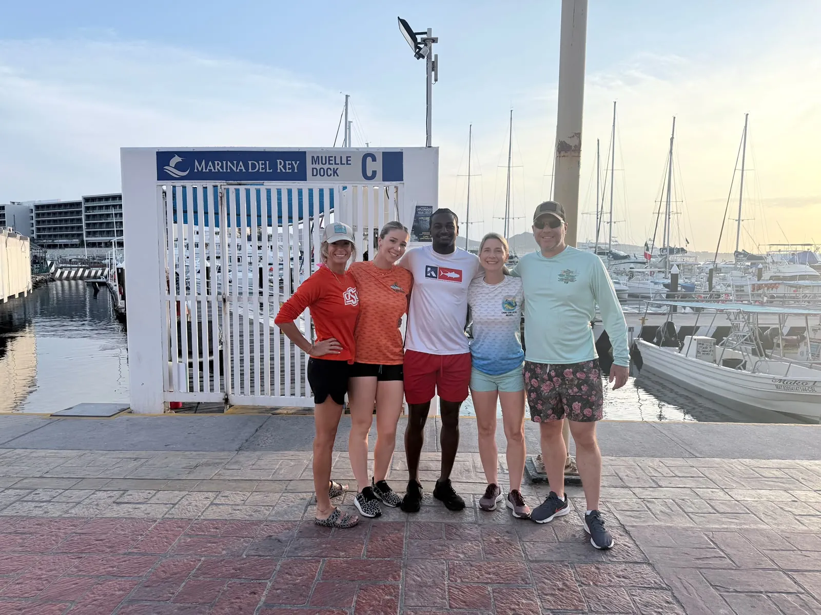A group of friends back at the dock after their trip, July 2026