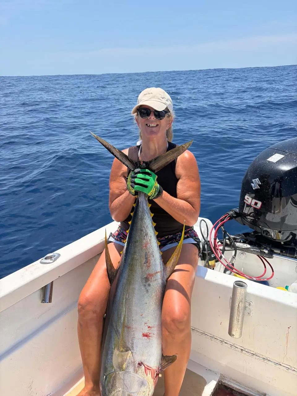 Angler with a yellowfin tuna, September 2026